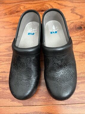 Dansko Black Embossed Floral Leather Clogs